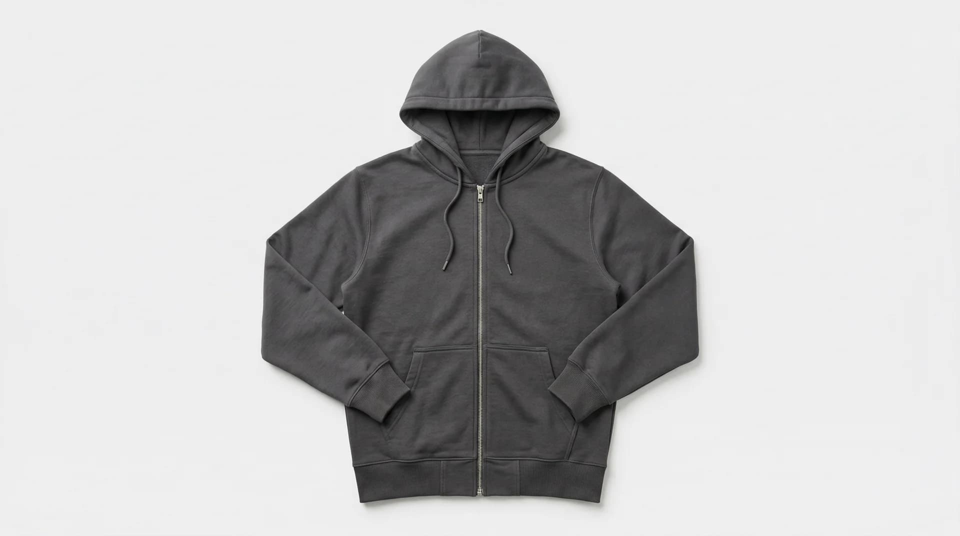 Charcoal grey zip-up hoodie laid flat on white background — garment photo ready for AI ghost mannequin processing